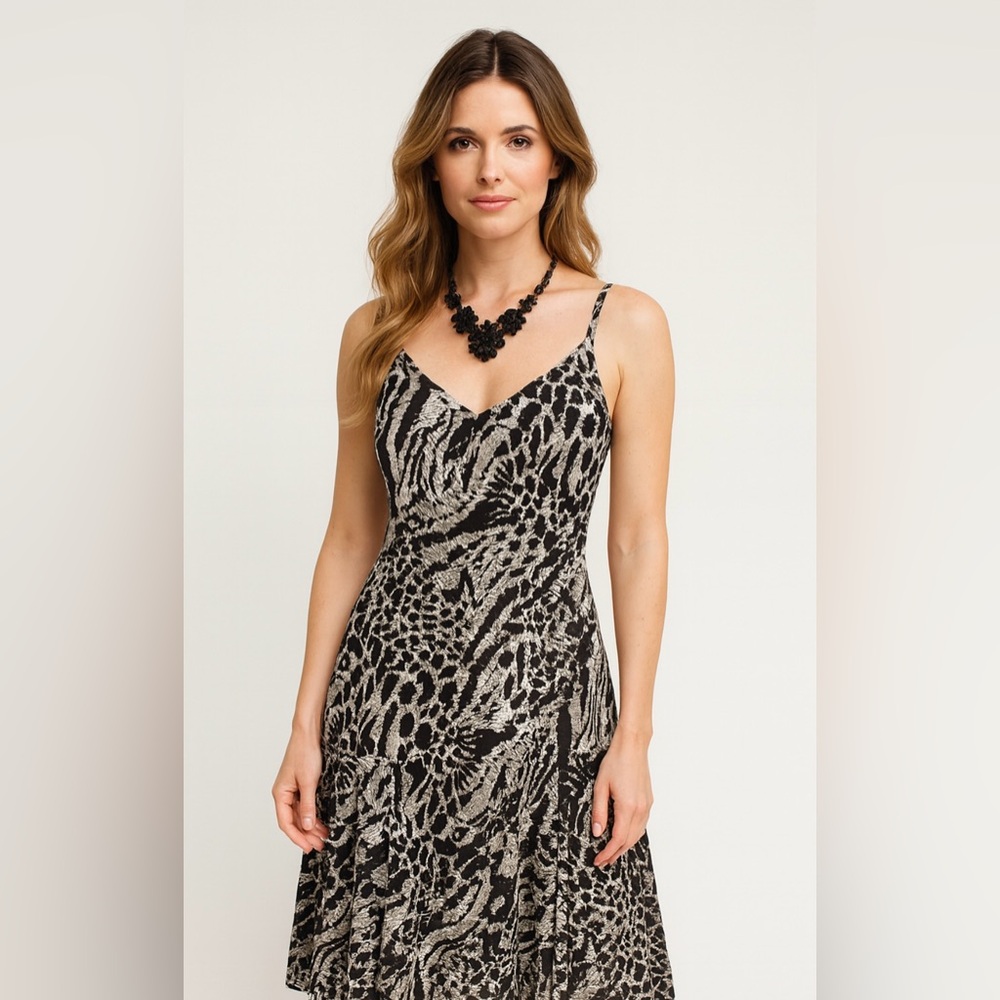 Bella , animal print dress with straps, black and white color, new without tag.